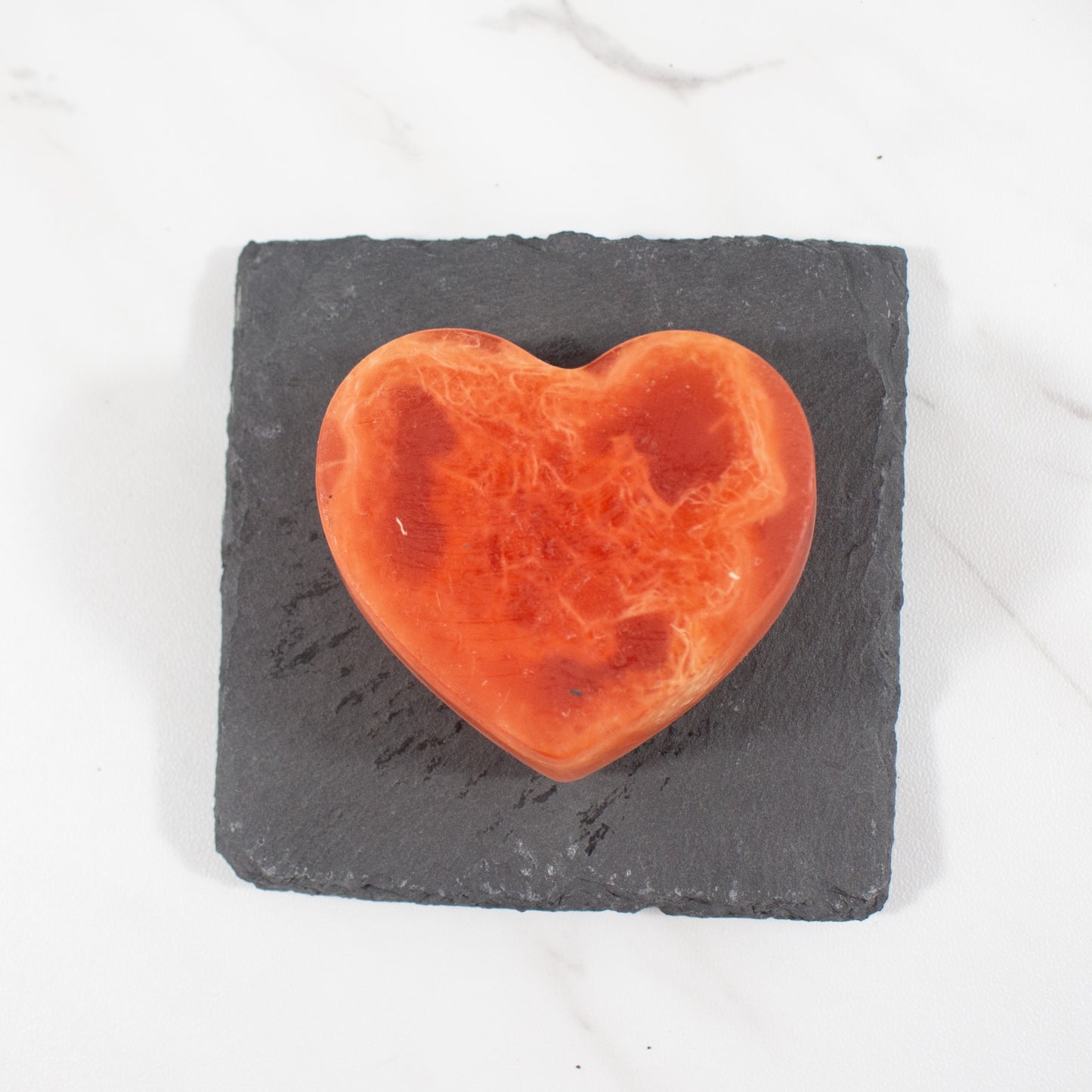 red heart shaped soap on slate